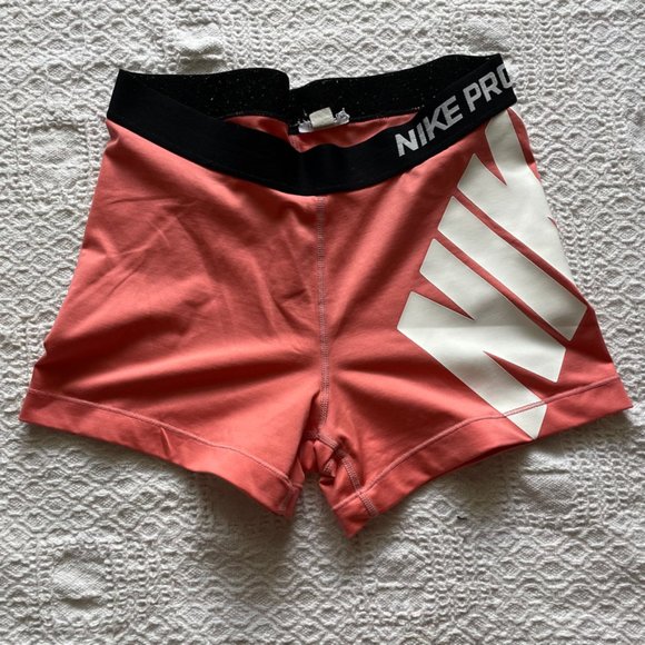 Nike Pants - Nike Pro pink medium rise running shorts size large